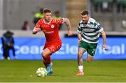 25 April 2025; Kameron Ledwidge of Shelbourne in action against Jack Byrne of Shamrock Rovers during the SSE Airtricity Men's Premier Division match between Shamrock Rovers and Shelbourne at Tallaght Stadium in Dublin. Photo by Ramsey Cardy/Sportsfile