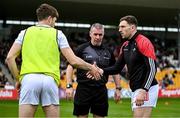 27 April 2025; Louth captain Sam Mulroy, right, shakes hands with Kildare captain Kevin Feeley in front of referee Brendan Griffin before the Leinster GAA Football Senior Championship semi-final match between Kildare and Louth at Glenisk O'Connor Park in Tullamore, Offaly. Photo by Shauna Clinton/Sportsfile