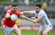 27 April 2025; Sam Mulroy of Louth is tackled by Mark Dempsey of Kildare during the Leinster GAA Football Senior Championship semi-final match between Kildare and Louth at Glenisk O'Connor Park in Tullamore, Offaly. Photo by Shauna Clinton/Sportsfile