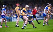 27 April 2025; Adam Hogan of Clare and Kevin Mahony of Waterford tussle off the ball during the Munster GAA Hurling Senior Championship Round 2 match between Waterford and Clare at Walsh Park in Waterford. Photo by Piaras Ó Mídheach/Sportsfile