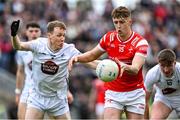 27 April 2025; Ryan Burns of Louth in action against Brian Byrne of Kildare during the Leinster GAA Football Senior Championship semi-final match between Kildare and Louth at Glenisk O'Connor Park in Tullamore, Offaly. Photo by Shauna Clinton/Sportsfile
