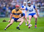 27 April 2025; John Conlon of Clare in action against Stephen Bennett of Waterford during the Munster GAA Hurling Senior Championship Round 2 match between Waterford and Clare at Walsh Park in Waterford. Photo by Piaras Ó Mídheach/Sportsfile