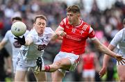 27 April 2025; Ryan Burns of Louth kicks a point despite the efforts of Brian Byrne of Kildare during the Leinster GAA Football Senior Championship semi-final match between Kildare and Louth at Glenisk O'Connor Park in Tullamore, Offaly. Photo by Shauna Clinton/Sportsfile