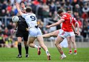 27 April 2025; Sam Mulroy of Louth kicks a point despite the efforts of Callum Bolton of Kildare during the Leinster GAA Football Senior Championship semi-final match between Kildare and Louth at Glenisk O'Connor Park in Tullamore, Offaly. Photo by Shauna Clinton/Sportsfile