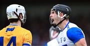 27 April 2025; Mark Fitzgerald of Waterford celebrates in front of Aidan McCarthy of Clare after a free was awarded to Waterford during the Munster GAA Hurling Senior Championship Round 2 match between Waterford and Clare at Walsh Park in Waterford. Photo by Piaras Ó Mídheach/Sportsfile