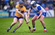 27 April 2025; Stephen Bennett of Wateford in action against David McInerney of Clare during the Munster GAA Hurling Senior Championship Round 2 match between Waterford and Clare at Walsh Park in Waterford. Photo by Piaras Ó Mídheach/Sportsfile