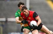 27 April 2025; Pat Havern of Down is tackled by Finnbarr Roarty of Donegal during the Ulster GAA Football Senior Championship semi-final match between Down and Donegal at St Tiernach's Park in Clones, Monaghan. Photo by Ben McShane/Sportsfile