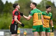 27 April 2025; John McGeough of Down and Ciaran Thompson of Donegal tussle during the Ulster GAA Football Senior Championship semi-final match between Down and Donegal at St Tiernach's Park in Clones, Monaghan. Photo by Ben McShane/Sportsfile