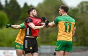 27 April 2025; John McGeough of Down and Ciaran Thompson of Donegal tussle during the Ulster GAA Football Senior Championship semi-final match between Down and Donegal at St Tiernach's Park in Clones, Monaghan. Photo by Ben McShane/Sportsfile