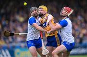 27 April 2025; Shane Meehan of Clare in action against Ian Kenny, left, and Tadhg De Búrca of Waterford during the Munster GAA Hurling Senior Championship Round 2 match between Waterford and Clare at Walsh Park in Waterford. Photo by Piaras Ó Mídheach/Sportsfile