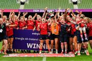 27 April 2025; Chloe Pearse captain of UL Bohemian lifts the cup as her team-mates celebrate after the the Energia All-Ireland League Women's Division 1 final match between Railway Union RFC and UL Bohemian at the Aviva Stadium in Dublin. Photo by Matt Browne/Sportsfile