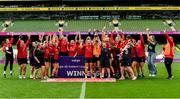 27 April 2025; Chloe Pearse captain of UL Bohemian lifts the cup as her team-mates celebrate after the the Energia All-Ireland League Women's Division 1 final match between Railway Union RFC and UL Bohemian at the Aviva Stadium in Dublin. Photo by Matt Browne/Sportsfile