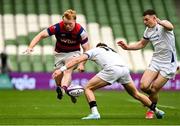 27 April 2025; Hugh Cooney of Clontarf is tackled by James Taylor of Cork Constitution during the Energia All-Ireland League Men's Division 1A final match between Clontarf and Cork Constitution at the Aviva Stadium in Dublin. Photo by Matt Browne/Sportsfile