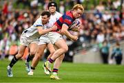 27 April 2025; Hugh Cooney of Clontarf is tackled by James Taylor of Cork Constitution during the Energia All-Ireland League Men's Division 1A final match between Clontarf and Cork Constitution at the Aviva Stadium in Dublin. Photo by Matt Browne/Sportsfile