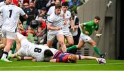 27 April 2025; Hugh Cooney of Clontarf scores a try despite the tackle from David Hyland of Cork Constitution during the Energia All-Ireland League Men's Division 1A final match between Clontarf and Cork Constitution at the Aviva Stadium in Dublin. Photo by Matt Browne/Sportsfile
