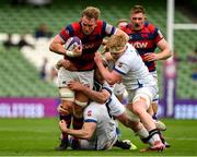 27 April 2025; John Vinson of Clontarf is tackled by Ronan O'Sullivan, Jack Kelleher and Niall Kenneally of Cork Constitution during the Energia All-Ireland League Men's Division 1A final match between Clontarf and Cork Constitution at the Aviva Stadium in Dublin. Photo by Matt Browne/Sportsfile