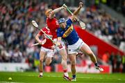 27 April 2025; Jason Forde of Tipperary in action against Niall O'Leary of Cork during the Munster GAA Hurling Senior Championship Round 2 match between Cork and Tipperary at SuperValu Páirc Uí Chaoimh in Cork. Photo by Brendan Moran/Sportsfile
