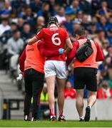 27 April 2025; Robert Downey of Cork leaves the pitch with an injury during the Munster GAA Hurling Senior Championship Round 2 match between Cork and Tipperary at SuperValu Páirc Uí Chaoimh in Cork. Photo by Brendan Moran/Sportsfile
