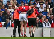 27 April 2025; Robert Downey of Cork leaves the pitch with an injury during the Munster GAA Hurling Senior Championship Round 2 match between Cork and Tipperary at SuperValu Páirc Uí Chaoimh in Cork. Photo by Brendan Moran/Sportsfile