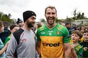 27 April 2025; Stephen McMenamin of Donegal shares a joke with Down manager Conor Laverty after the Ulster GAA Football Senior Championship semi-final match between Down and Donegal at St Tiernach's Park in Clones, Monaghan. Photo by Ben McShane/Sportsfile