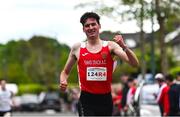 27 April 2025; Dylan Casey of Ennis Track AC, Clare, crosses the finish line to win the men's senior relay during the 123.ie National Road Relay Championships in Raheny, Dublin. Photo by Tyler Miller/Sportsfile