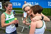 27 April 2025; Brid Nichonail of Raheny Shamrock AC, Dublin, right, is embraced by team-mates Maria Dolan, centre, and Lorraine Byrne after competing in the women's masters event during the 123.ie National Road Relay Championships in Raheny, Dublin. Photo by Tyler Miller/Sportsfile