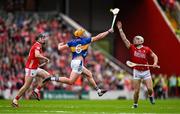 27 April 2025; Ronan Maher of Tipperary in action against Luke Meade of Cork during the Munster GAA Hurling Senior Championship Round 2 match between Cork and Tipperary at SuperValu Páirc Uí Chaoimh in Cork. Photo by Brendan Moran/Sportsfile