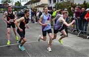 27 April 2025; Athletes takover in the senior men's event during the 123.ie National Road Relay Championships in Raheny, Dublin. Photo by Tyler Miller/Sportsfile