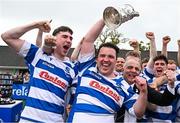 27 April 2025; Athy captain Tadgh Foley lifts the Leinster Junior Challenge Cup after alongside teammates after their side's victory in the  the Bank of Ireland Provincial Towns Cup final match between Athy RFC and County Carlow FC at Forenaughts in Naas, Kildare. Photo by Seb Daly/Sportsfile
