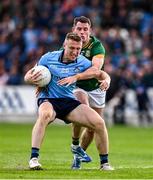 27 April 2025; Paddy Small of Dublin is tackled by Donal Keogan of Meath during the Leinster GAA Football Senior Championship semi-final match between Dublin and Meath at Laois Hire O'Moore Park in Portlaoise, Laois. Photo by Ray McManus/Sportsfile