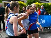 27 April 2025; Eimear Maher of Dundrum South Dublin AC, centre, celebrates with team-mates Maria McCambridge, Eimear Maher, right, and Emma McEvoy after winning the senior women's event during the 123.ie National Road Relay Championships in Raheny, Dublin. Photo by Tyler Miller/Sportsfile