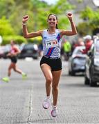 27 April 2025; Eimear Maher of Dundrum South Dublin AC, Dublin, celebrates after winning the senior women's event during the 123.ie National Road Relay Championships in Raheny, Dublin. Photo by Tyler Miller/Sportsfile