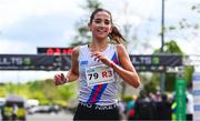 27 April 2025; Eimear Maher of Dundrum South Dublin AC, Dublin, celebrates after winning the senior women's event during the 123.ie National Road Relay Championships in Raheny, Dublin. Photo by Tyler Miller/Sportsfile