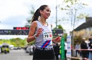 27 April 2025; Eimear Maher of Dundrum South Dublin AC, Dublin, celebrates after winning the senior women's event during the 123.ie National Road Relay Championships in Raheny, Dublin. Photo by Tyler Miller/Sportsfile