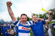 27 April 2025; Athy captain Tadgh Foley celebrates with a supporter after their side's victory in the Bank of Ireland Provincial Towns Cup final match between Athy RFC and County Carlow FC at Forenaughts in Naas, Kildare. Photo by Seb Daly/Sportsfile