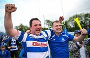 27 April 2025; Athy captain Tadgh Foley celebrates with a supporter after their side's victory in the Bank of Ireland Provincial Towns Cup final match between Athy RFC and County Carlow FC at Forenaughts in Naas, Kildare. Photo by Seb Daly/Sportsfile