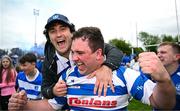 27 April 2025; Athy captain Tadgh Foley celebrates with a supporter after their side's victory in the Bank of Ireland Provincial Towns Cup final match between Athy RFC and County Carlow FC at Forenaughts in Naas, Kildare. Photo by Seb Daly/Sportsfile