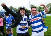 27 April 2025; Athy captain Tadgh Foley celebrates with a supporter after their side's victory in the Bank of Ireland Provincial Towns Cup final match between Athy RFC and County Carlow FC at Forenaughts in Naas, Kildare. Photo by Seb Daly/Sportsfile