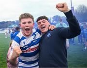27 April 2025; Darragh Farrell of Athy, left, celebrate with a supporter after their side's victory in the Bank of Ireland Provincial Towns Cup final match between Athy RFC and County Carlow FC at Forenaughts in Naas, Kildare. Photo by Seb Daly/Sportsfile