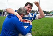 27 April 2025; James Sheedy of Athy celebrates with a supporter after their side's victory in the Bank of Ireland Provincial Towns Cup final match between Athy RFC and County Carlow FC at Forenaughts in Naas, Kildare. Photo by Seb Daly/Sportsfile