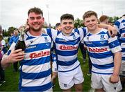27 April 2025; Athy players, from left, Karol Donohoe, James Harris and Darragh Farrell celebrate after their side's victory the Bank of Ireland Provincial Towns Cup final match between Athy RFC and County Carlow FC at Forenaughts in Naas, Kildare. Photo by Seb Daly/Sportsfile