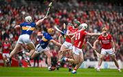 27 April 2025; Séamus Harnedy of Cork scores a point despite the best efforts of Ronan Maher and Bryan O'Mara of Tipperary during the Munster GAA Hurling Senior Championship Round 2 match between Cork and Tipperary at SuperValu Páirc Uí Chaoimh in Cork. Photo by Brendan Moran/Sportsfile