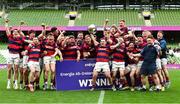 27 April 2025; Dylan Donnellan captain of Clontarf lifts the cup as his team-metes celebrate after the Energia All-Ireland League Men's Division 1A final match between Clontarf and Cork Constitution at the Aviva Stadium in Dublin. Photo by Matt Browne/Sportsfile