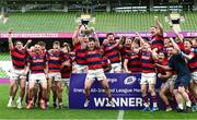 27 April 2025; Dylan Donnellan captain of Clontarf lifts the cup as his team-metes celebrate after the Energia All-Ireland League Men's Division 1A final match between Clontarf and Cork Constitution at the Aviva Stadium in Dublin. Photo by Matt Browne/Sportsfile