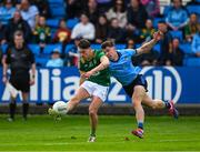27 April 2025; James Conlon of Meath kicks a first half point, under pressure from David Byrne of Dublin, during the Leinster GAA Football Senior Championship semi-final match between Dublin and Meath at Laois Hire O'Moore Park in Portlaoise, Laois. Photo by Ray McManus/Sportsfile