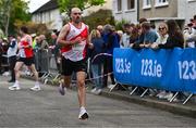 27 April 2025; Tom Kelleher of Sportsworld AC, Dublin, competes in the senior men's event during the 123.ie National Road Relay Championships in Raheny, Dublin. Photo by Tyler Miller/Sportsfile