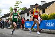 27 April 2025; Tomas Fitzpatrick of Tallaght AC, right, and Andrew Connick of Ferrybank AC, Waterford, compete in the men's 35+ event during the 123.ie National Road Relay Championships in Raheny, Dublin. Photo by Tyler Miller/Sportsfile
