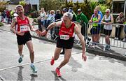 27 April 2025; Colin Roberts of City of Derry Spartans, Derry, takes over from team-mate Declan Reed whilst competing in the men's 50+ event during the 123.ie National Road Relay Championships in Raheny, Dublin. Photo by Tyler Miller/Sportsfile