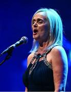 27 April 2025; Edel Nic Éanaigh sings Amhrán na bhFiann before the 2025 Scór Sinsear All-Ireland Finals at the TF Theatre in Castlebar, Mayo. Photo by Shauna Clinton/Sportsfile