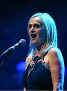 27 April 2025; Edel Nic Éanaigh sings Amhrán na bhFiann before the 2025 Scór Sinsear All-Ireland Finals at the TF Theatre in Castlebar, Mayo. Photo by Shauna Clinton/Sportsfile